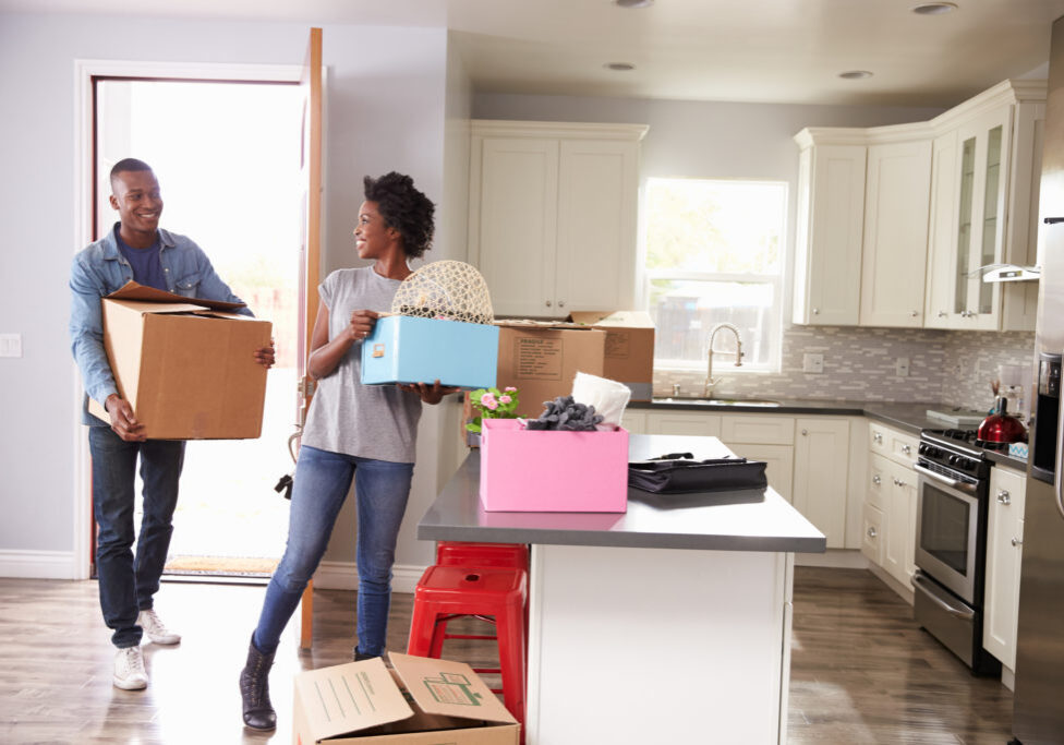 Young Couple Moving In To New Home Together